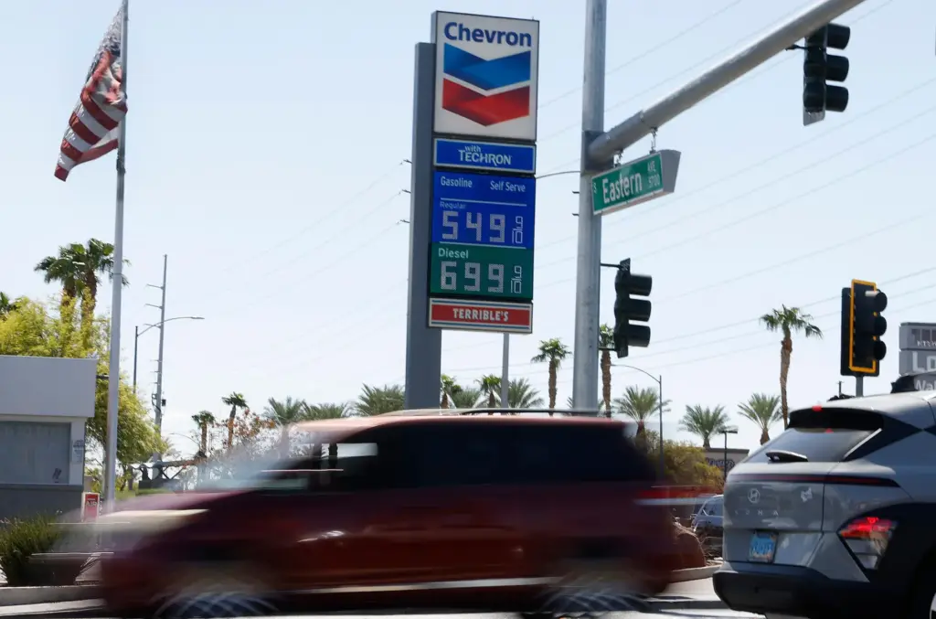A Chevron station displays its gas prices on Friday, Sept....