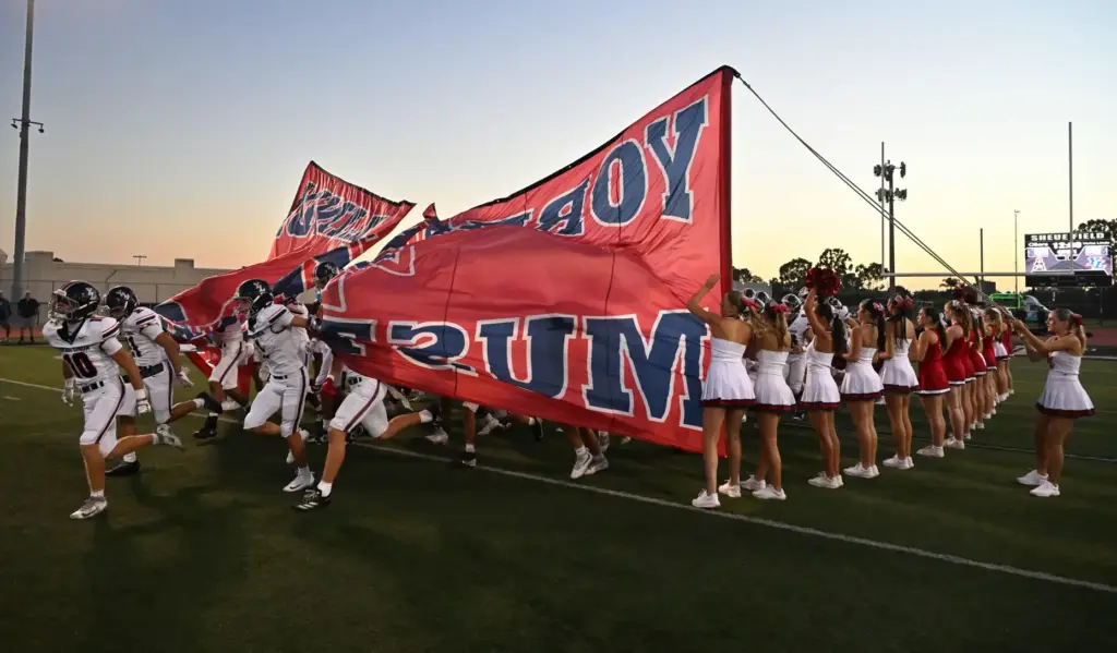 The Yorba Linda football team takes the field, September 18,...