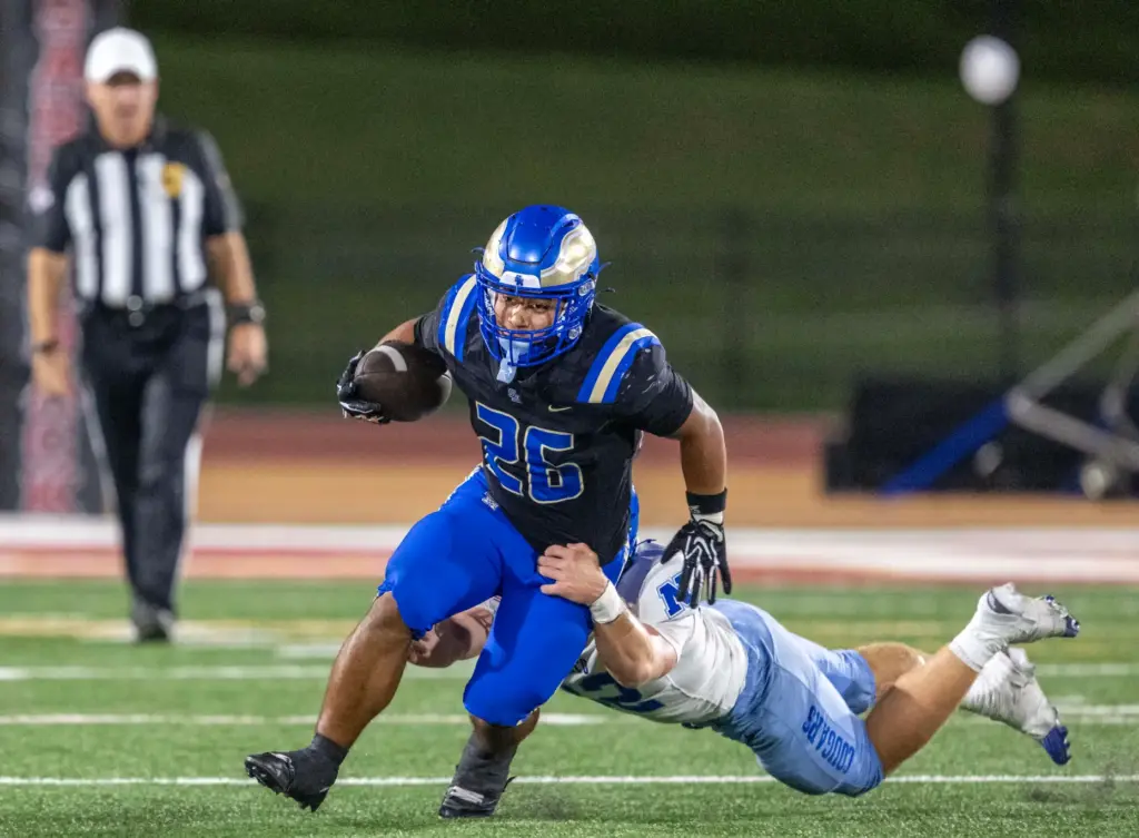 Santa Margarita running back Adrian Petero (26) breaks a tackle...