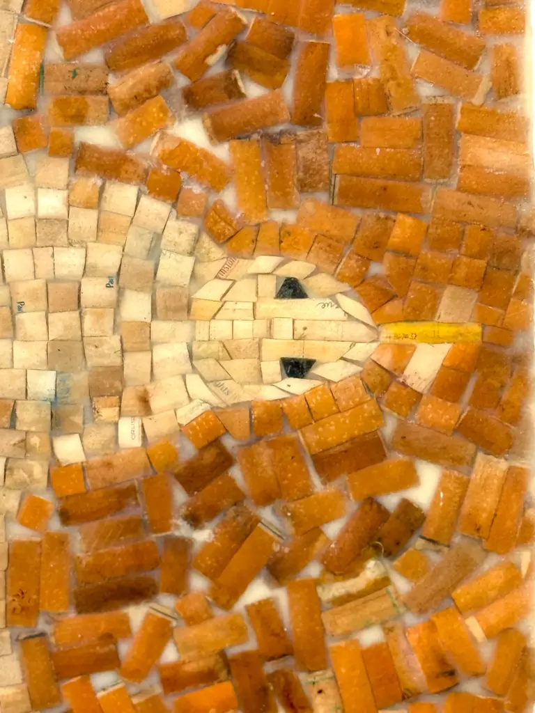 Detail of a surfboard made with cigarette butts collected from...