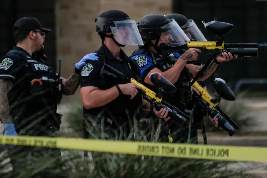 Authorities deploy non-lethan weapons near a demonstration where a man was shot by ICE.
