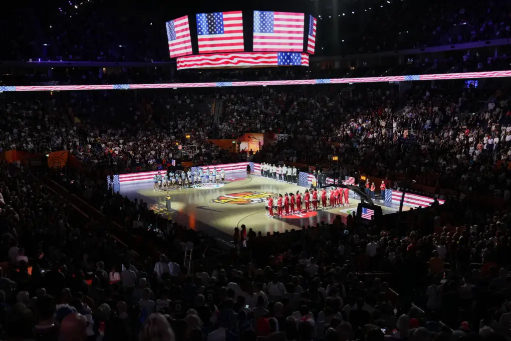 Team USA players stand for the national anthem before facing...