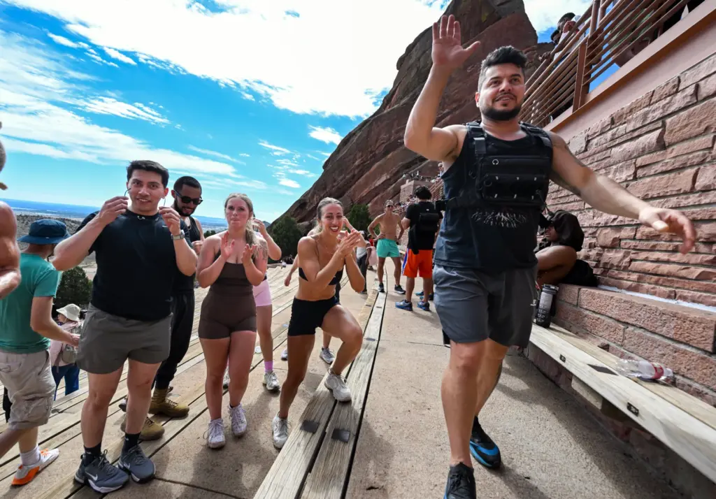 Ali Aldarraji, right, high-fives members of his exercise group after...