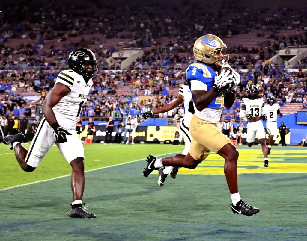 Wide receiver Semaj Morgan (4) of the UCLA Bruins catches...