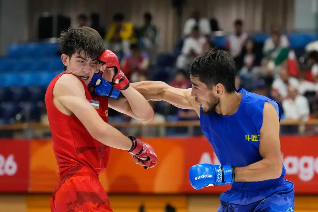 Firdaus Atamuratov of Uzbekistan competes with Mirzobek Umarov of Tajikistan.