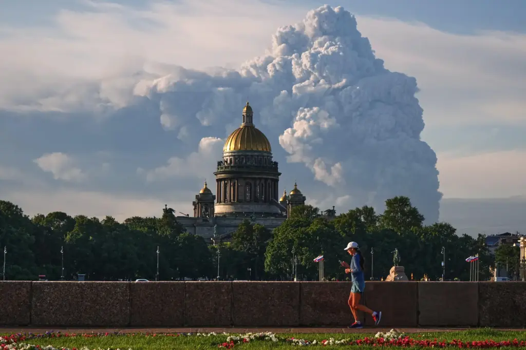 Smoke rises after a Ukrainian drone strikes on warehouses of Wildberries.