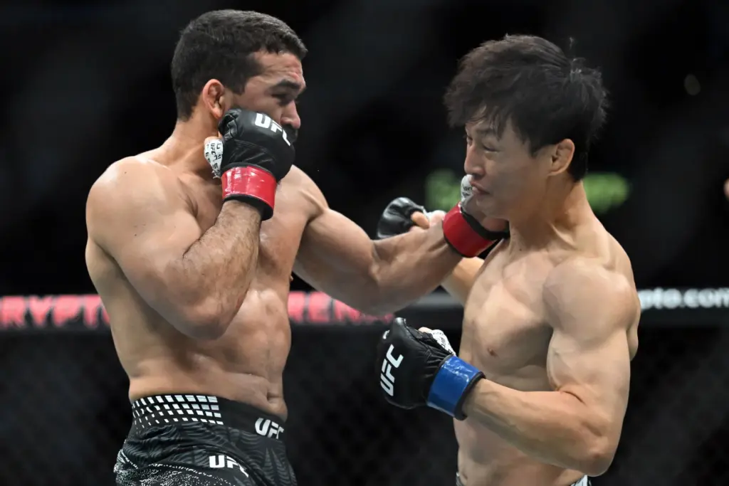 Patricio Pitbull (red) vs. Dooho Choi (blue) during their fight...