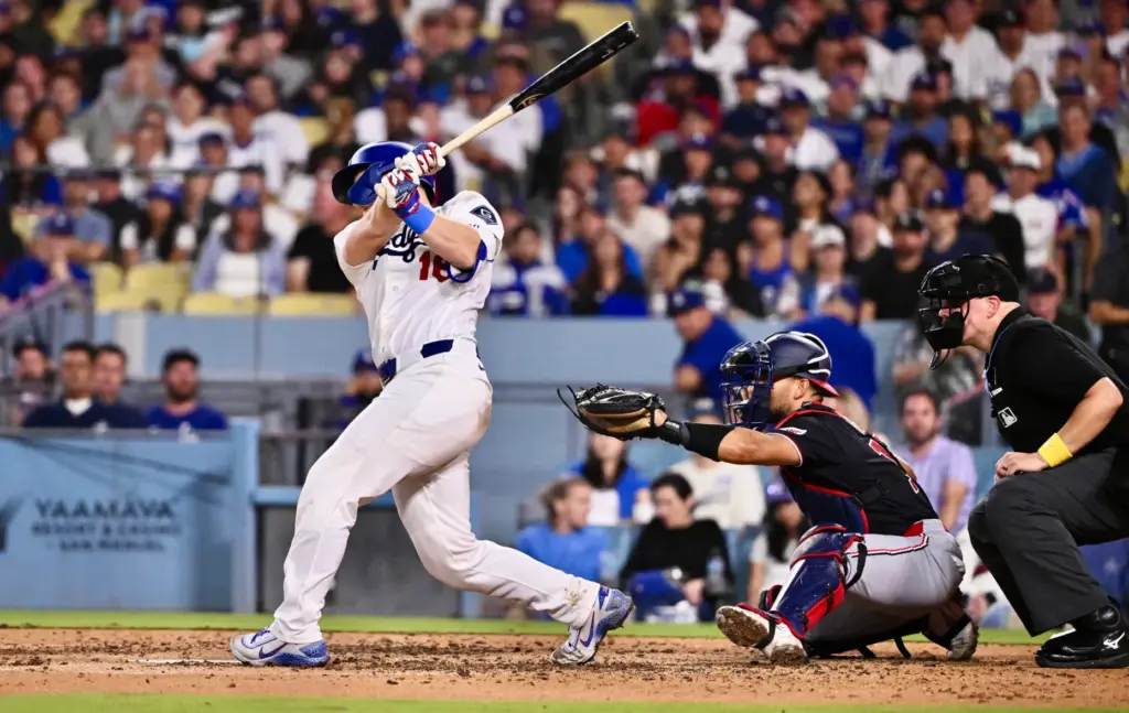 Dodgers catcher Will Smith hits an RBI single as teammate...