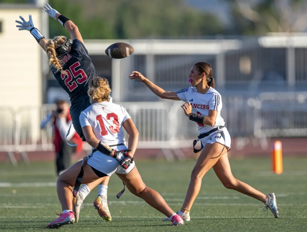 Orange Lutheran quarterback Alyssa McClure (3) throws the ball during...