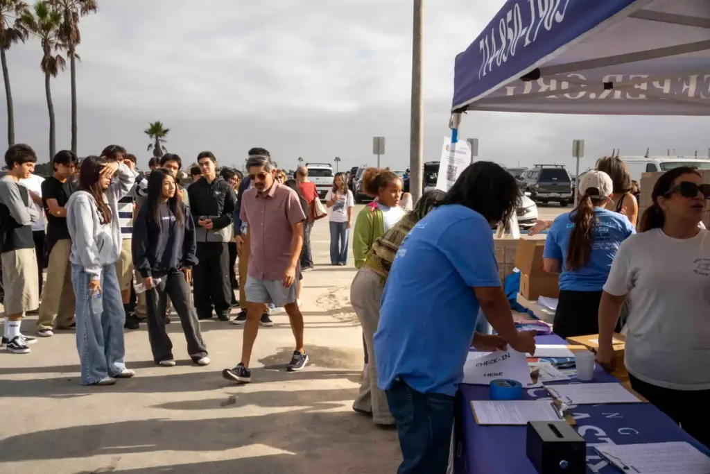 Volunteers line up to take part in California Coastal Cleanup...