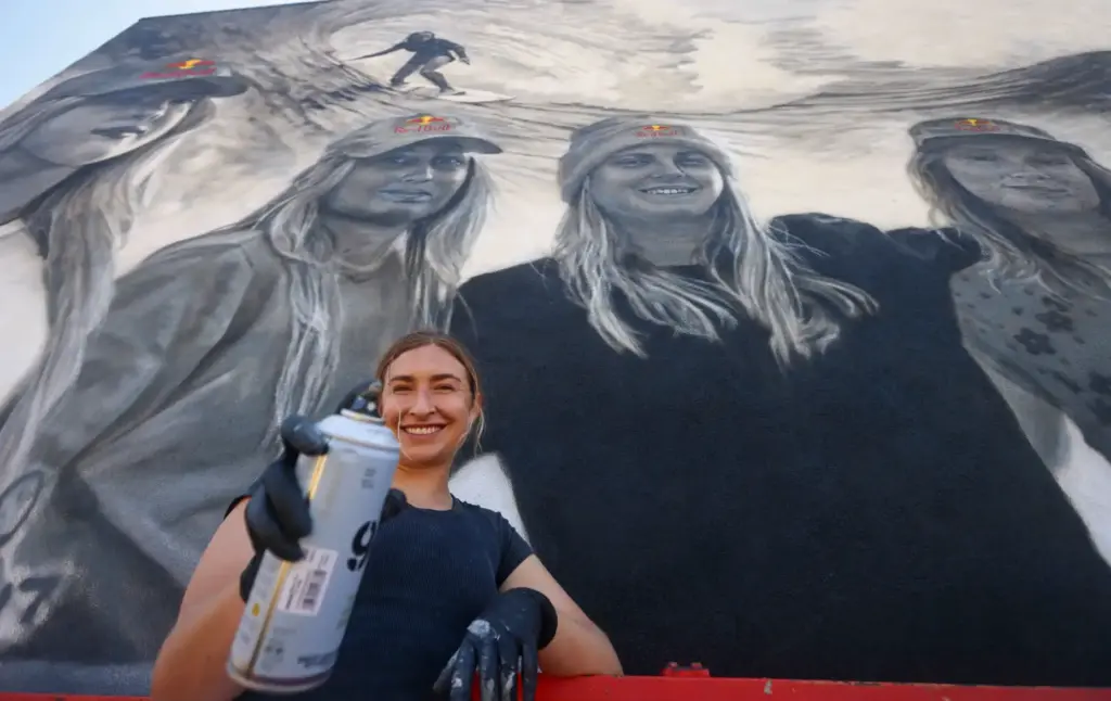 Artist Julie Engelmann of Half Moon Bay paints a mural...