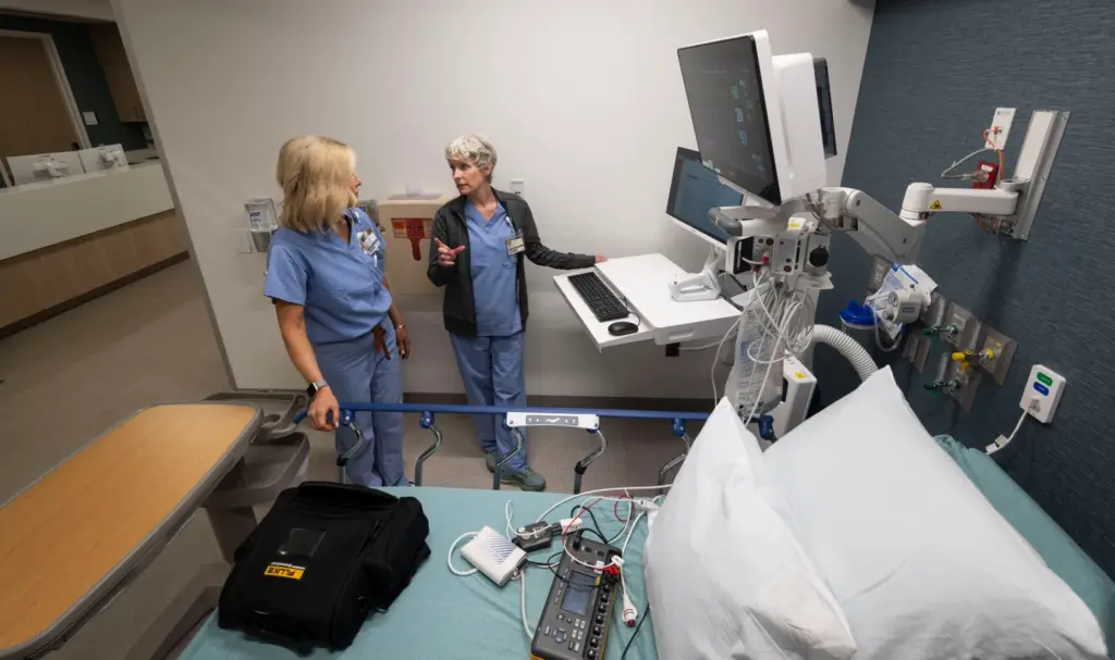 Registered nurses Heather Vittori and Kelly Kathiria, from left, set...