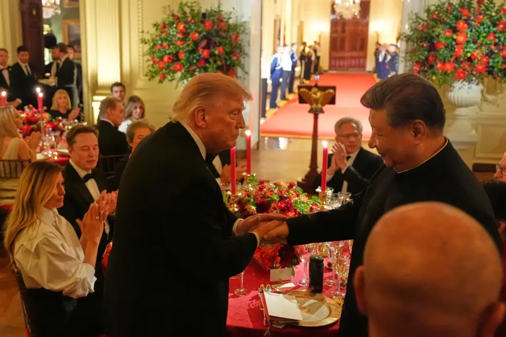 President Donald Trump shakes hands with China's President Xi Jinping.