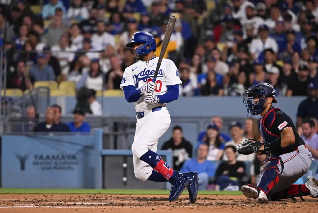Dodgers shortstop Mookie Betts hits an RBI groundout as teammate...