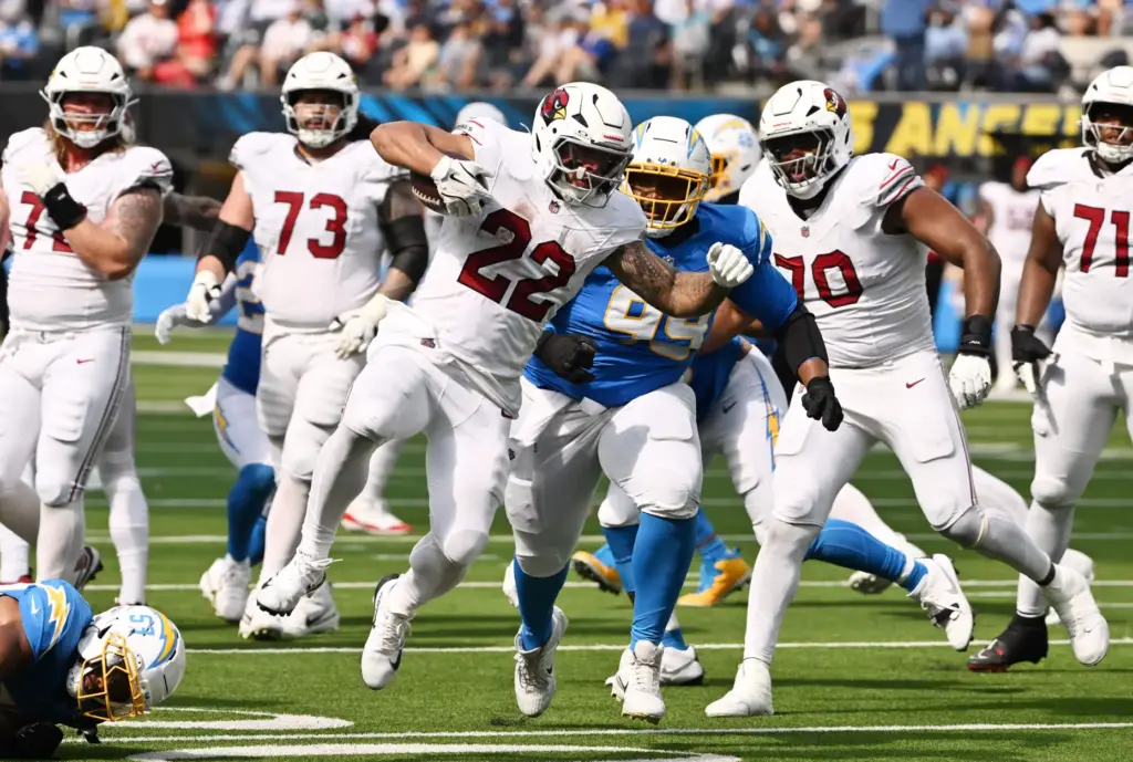 Arizona Cardinals running back Tyler Allgeier (22) runs for a...