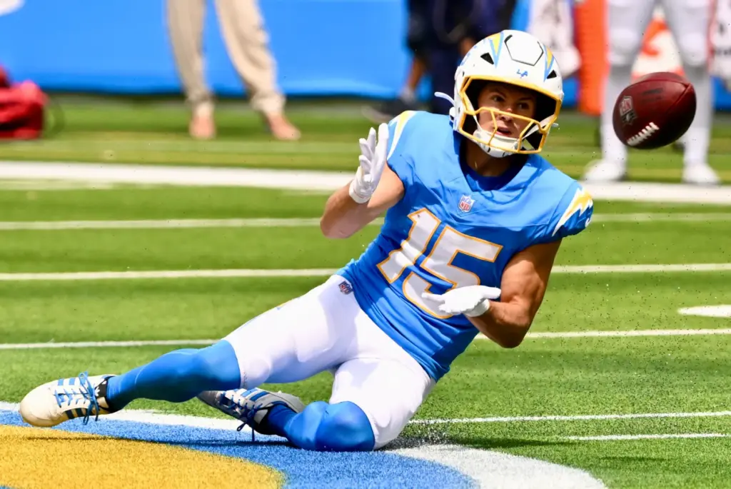 Chargers wide receiver Ladd McConkey (15) catches a pass for...