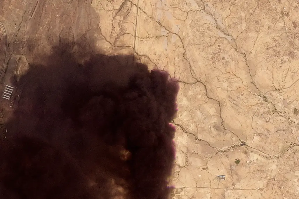 This image provided by Planet Labs PBC shows a plume...