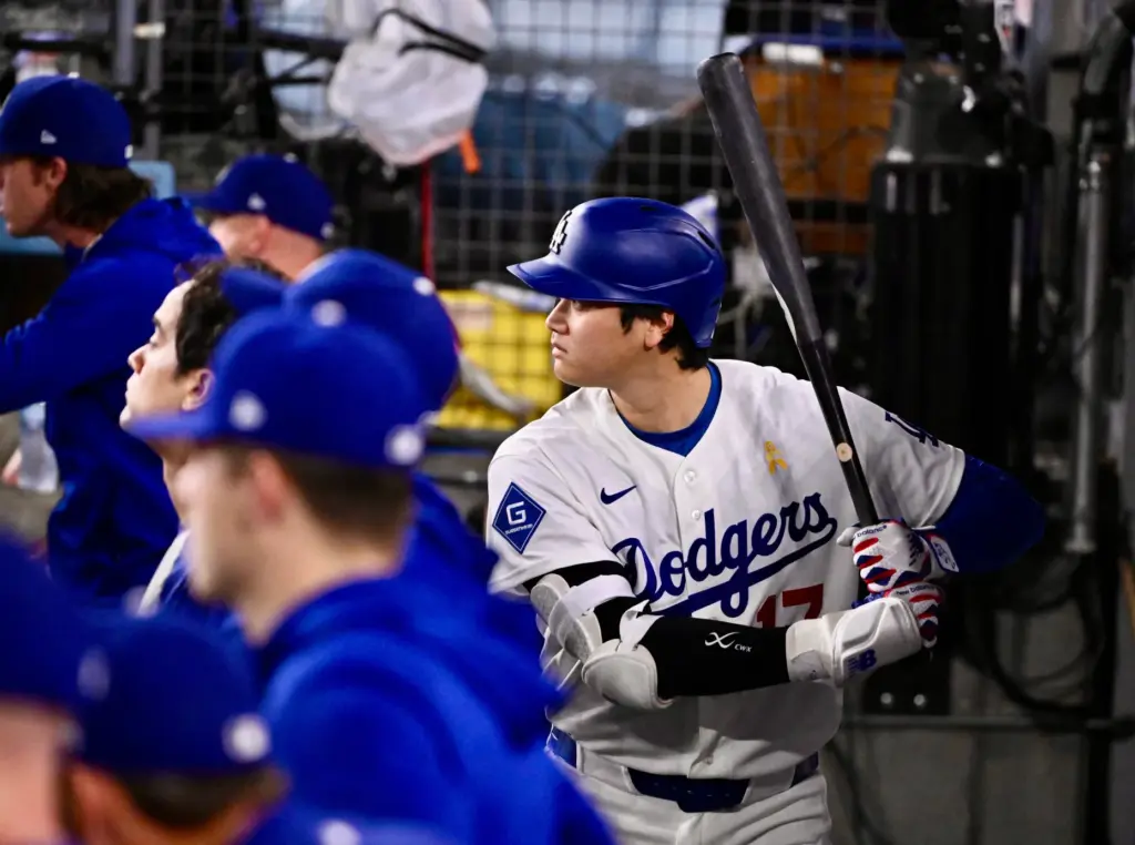 Dodgers star Shohei Ohtani holds a bat during the eighth...