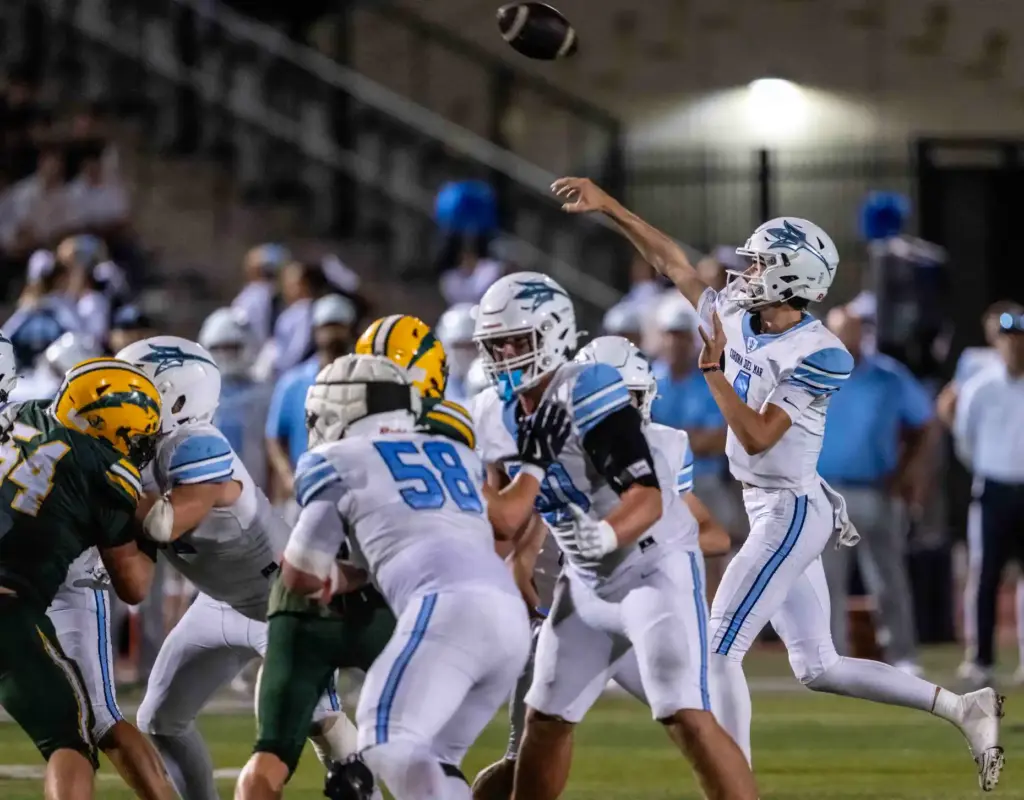 Corona del Mar quarterback John David Annett (4) throws the...