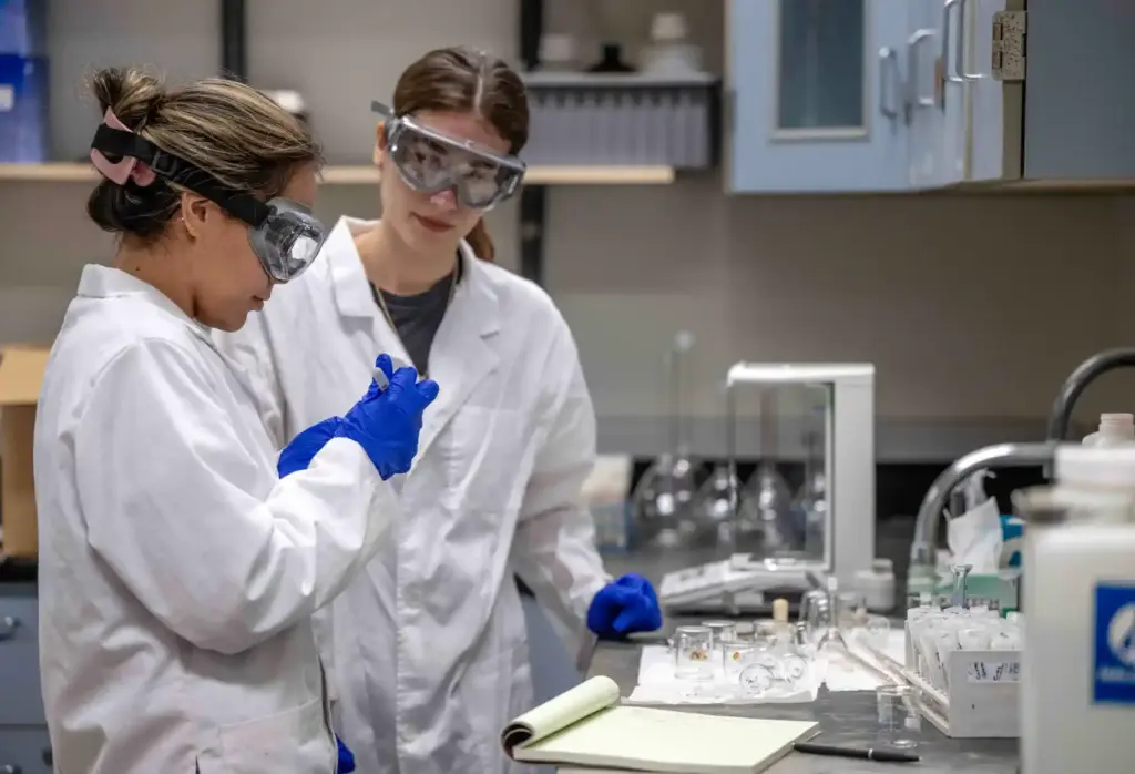 Cal State Fullerton biochemistry students Angela Escamilla, left, and Anita...