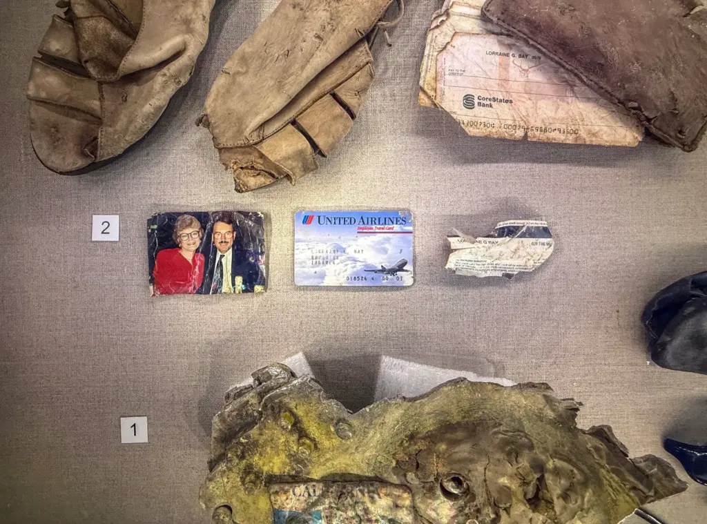 Items from passengers recovered at the crash site are displayed...