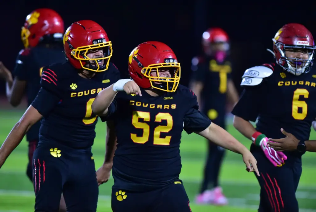 Hawthorne’s Ricardo Robinson (52) celebrates fumble recovery against Leuzinger in...