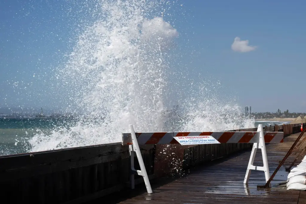 A large swell generated by Hurricane Polo slams into the...