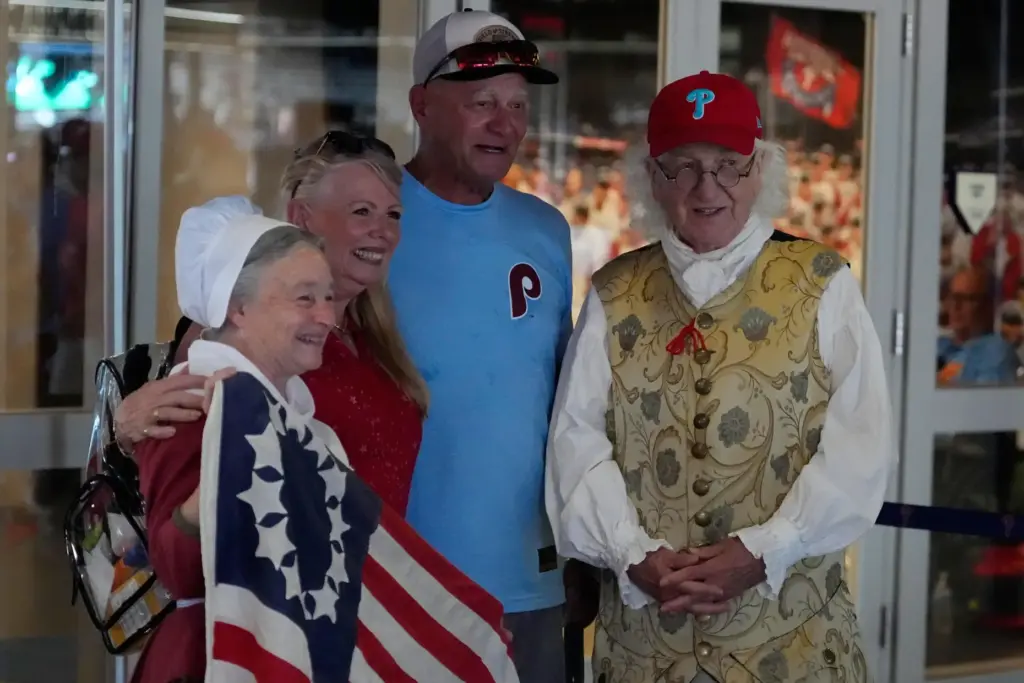 Bill Robling as Benjamin Franklin, right, and Carol Spacht as...