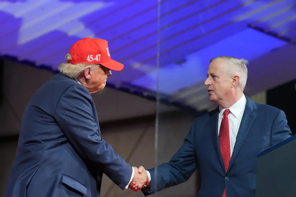 President Donald Trump greets North Carolina Republican U.S. Senate candidate Michael Whatley.