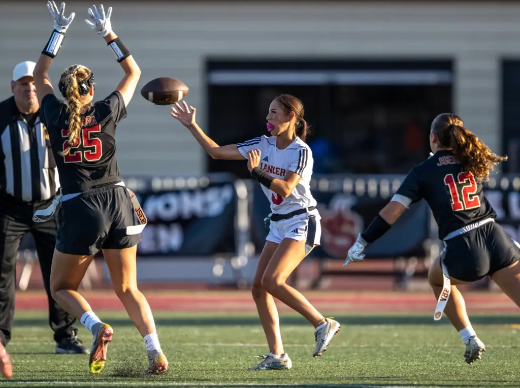 Orange Lutheran quarterback Alyssa McClure (3) throws the ball during...