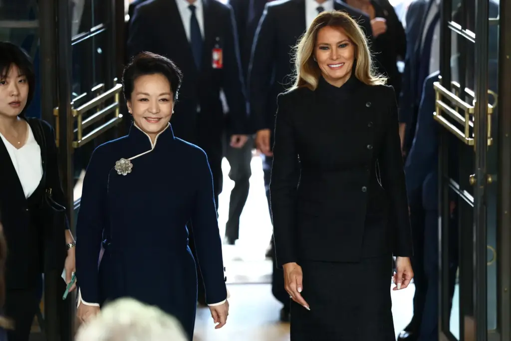 First lady of China Peng Liyuan, left, and first lady...