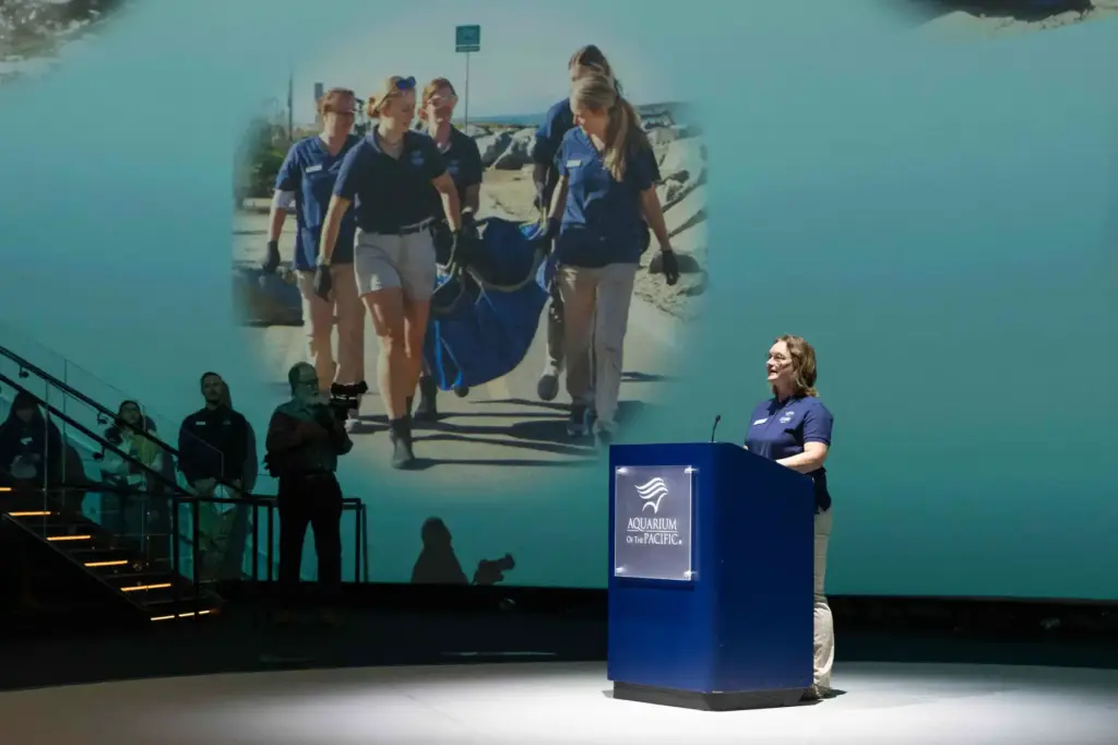 Volunteer Services Director Cassandra Davis speaks during the grand opening...