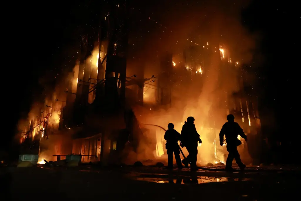 Rescue workers put out a fire at the Intrade trade center after a Russian drone strike.