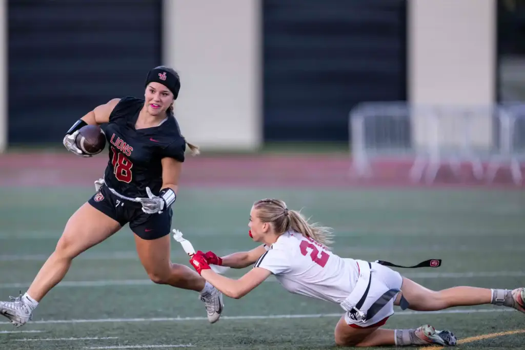 Orange Lutheran defensive back Bryn Wessel (20), right, pulls JSerraâs...