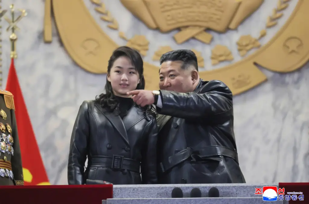 Kim Jong Un attends a parade with his daughter in Pyongyang.