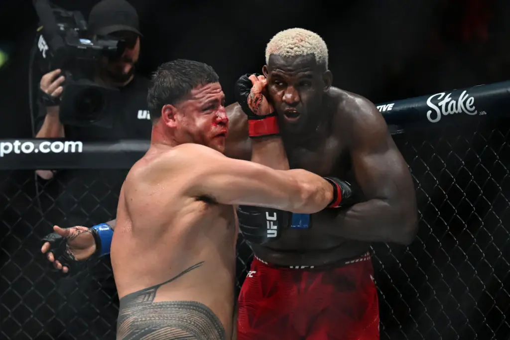 Tai Tuivasa (red) vs. Robelis Despaigne (blue) during their fight...