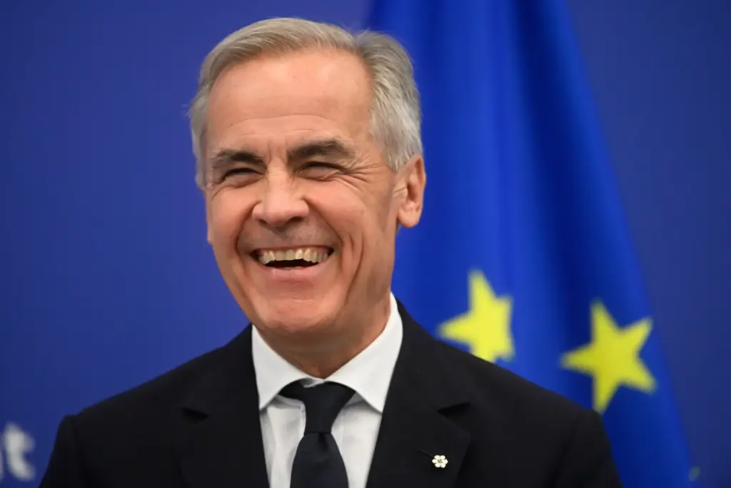 Canada's Prime Minister Mark Carney smiles during a news conference at the European Parliament.