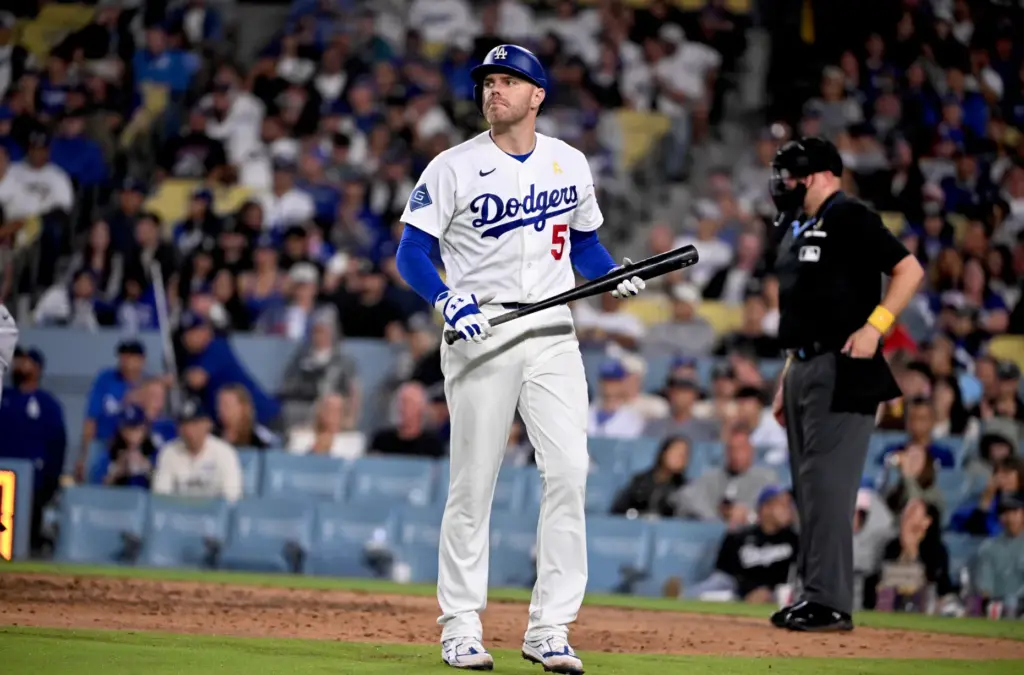 Dodgers first baseman Freddie Freeman walks toward the dugout after...
