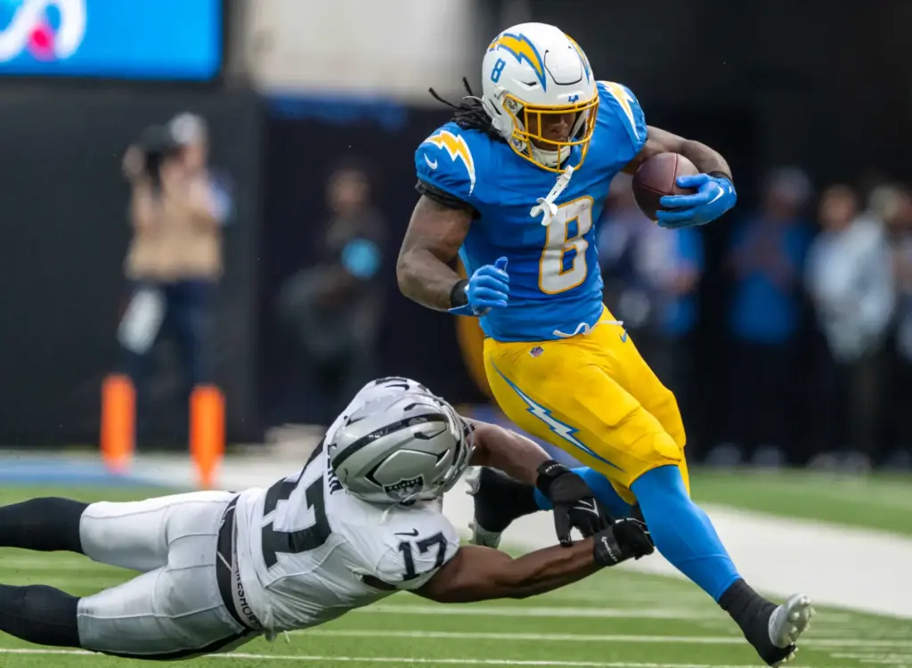 Chargers running back Omarion Hampton (8) carries the ball during...