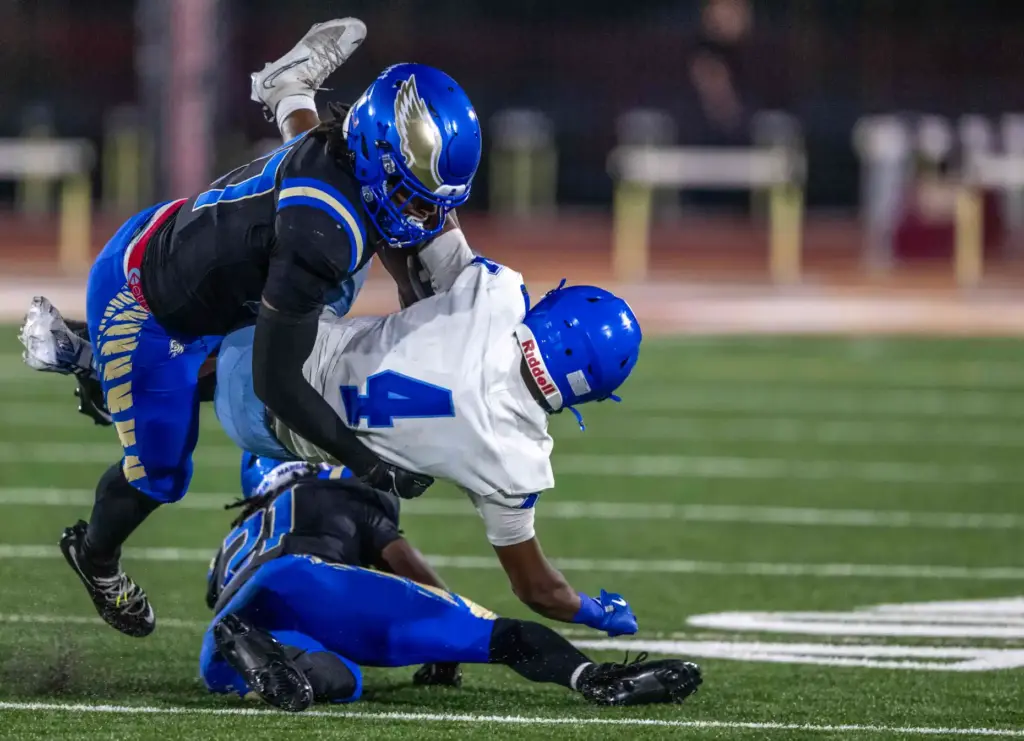 Santa Margarita defender Kaleb Herndon (27) tackles Norco running back...
