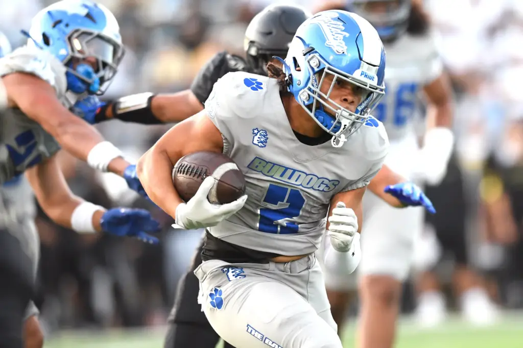 Burbankâs Troy Wells carries the ball during game against Calabasas...