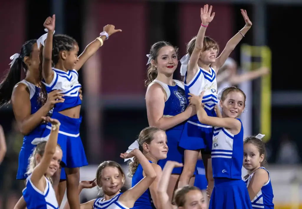 Junior Eagles perform with the Santa Margarita cheerleaders during the...