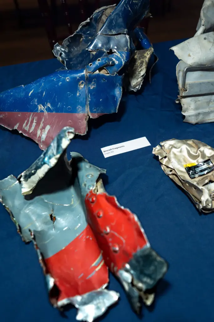 Pieces of the metal fuselage recovered from the wreckage of...