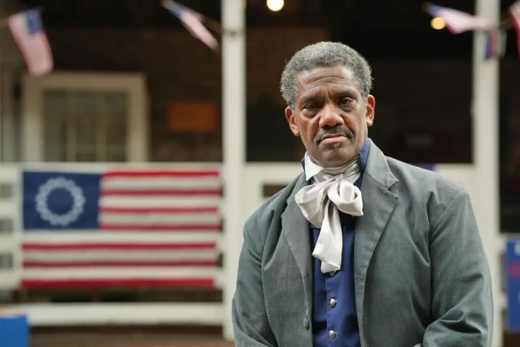 Historic reenactor Keith Henley, performing as abolitionist James Fowler, poses...