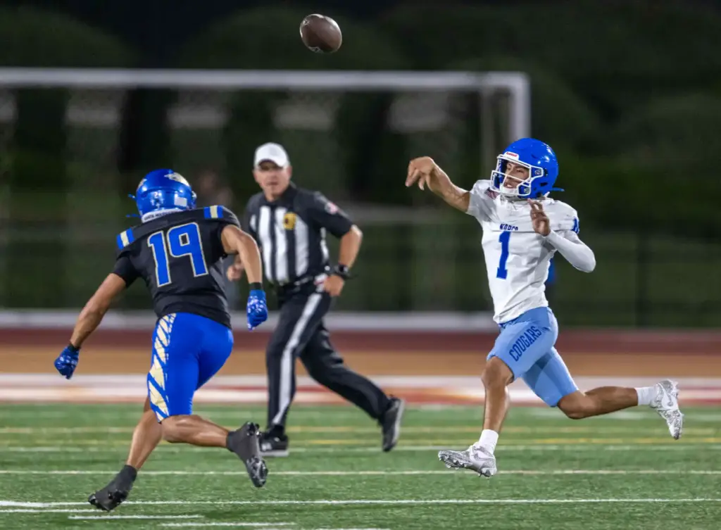 Norco quarterback Julian Medina (1) throws the ball while on...