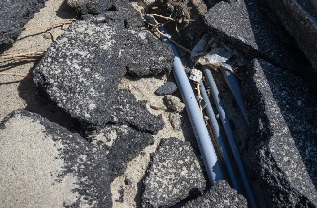 A storm damaged Aliso Beach in Laguna reveals exposed wires...