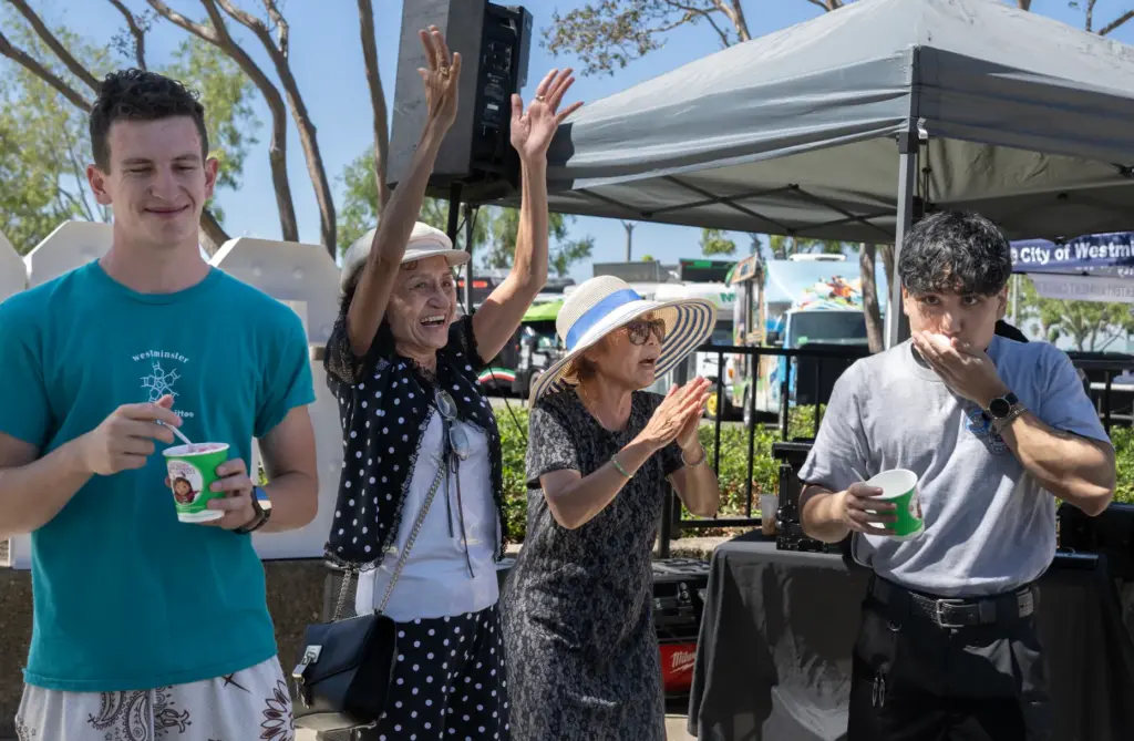 James Bang, right, is cheered as he wins the Hawaiian...