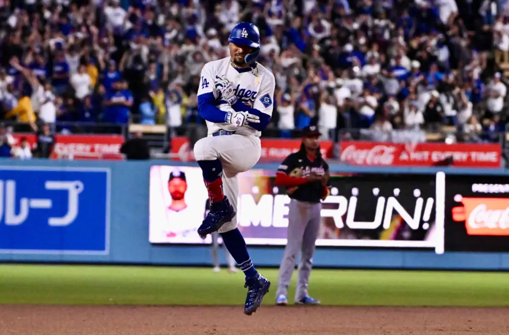 Dodgers shortstop Mookie Betts celebrates hitting a three-run home run...