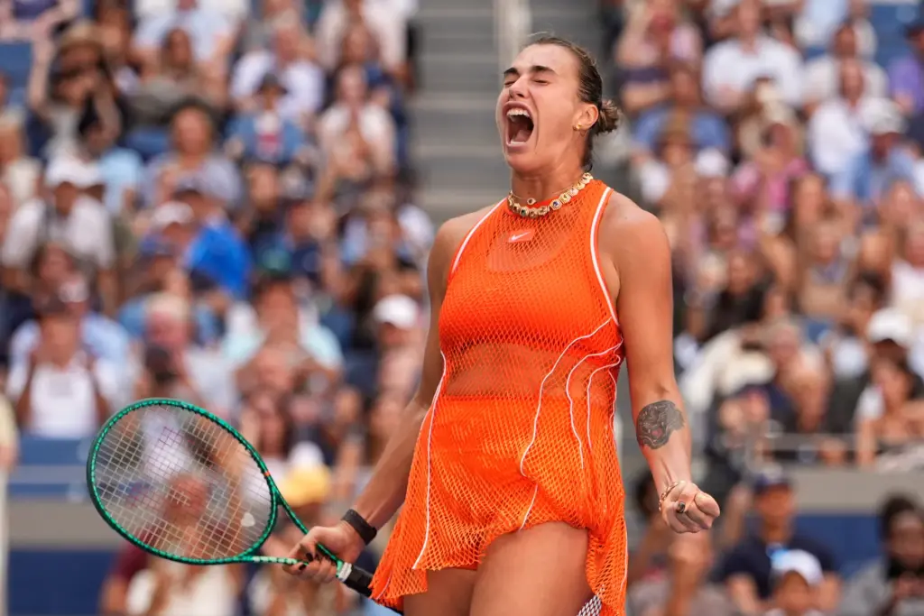 Aryna Sabalenka, of Belarus, celebrates winning a match against Linda...
