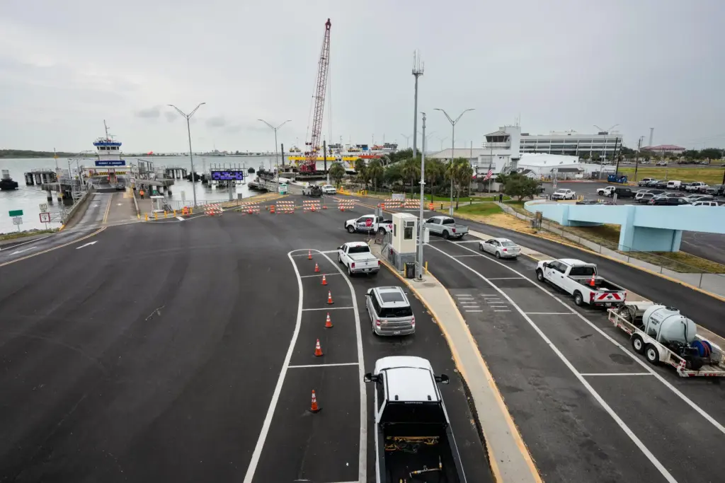 Vehicle line up to board a Bolivar Ferry ahead of...